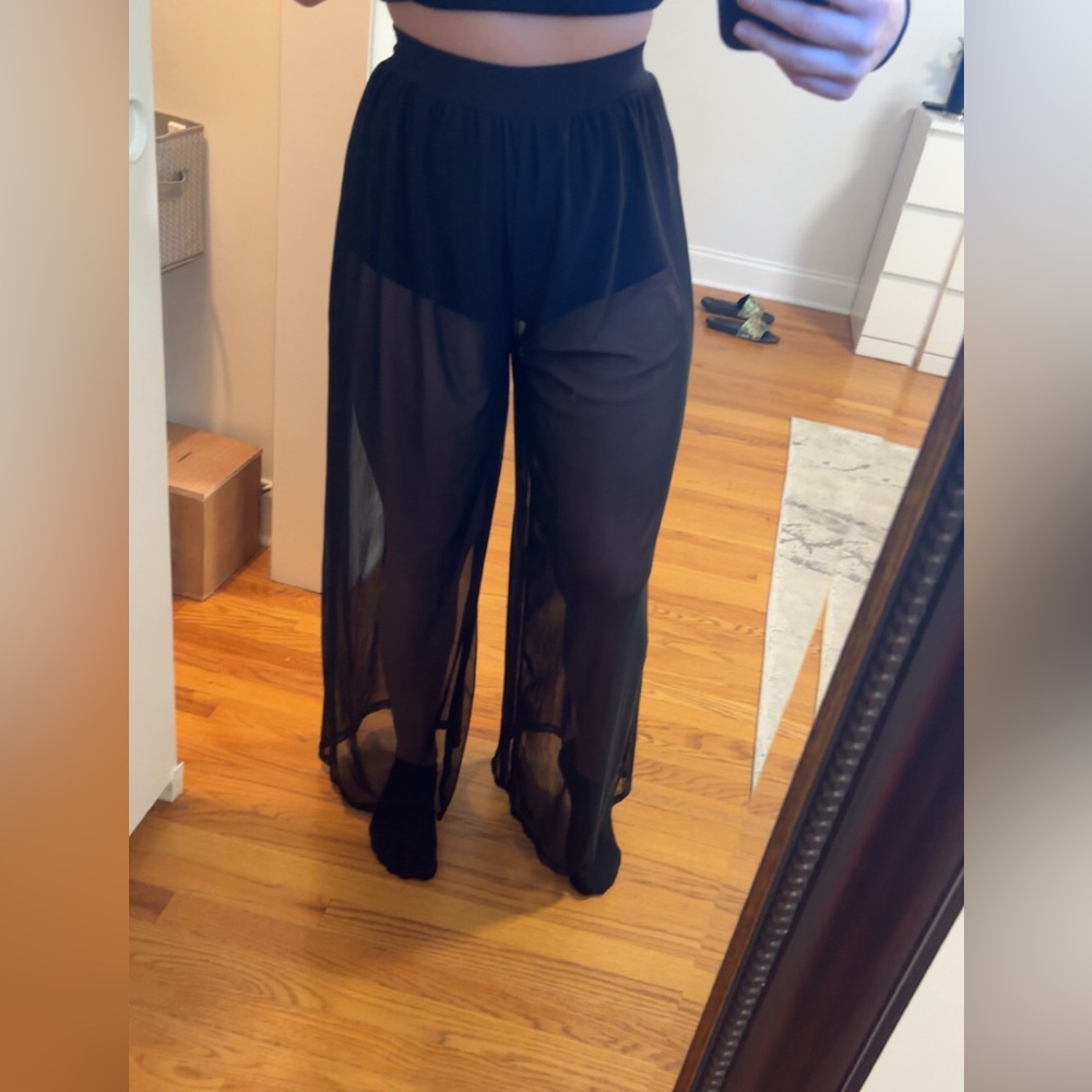 MESH PANTS WITH SHORTS UNDERNEATH.